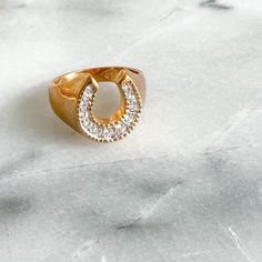 Pave crystal horseshoe ring. Vintage. One of a kind. 10K gold electroplated. Size 12. Unisex. Sustainable fashion item. Comes in linen travel pouch. Gold Horseshoe Ring, Horseshoe Ring, Unisex Ring, Travel Pouch, 10k Gold, Fashion Item, Sustainable Fashion, Gemstone Rings, Pouch