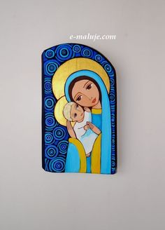 an image of the virgin mary holding a baby in her arms with blue swirls on it