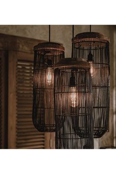 three hanging lights made out of bird cages