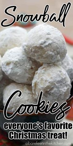 a bowl filled with snowball cookies on top of a table