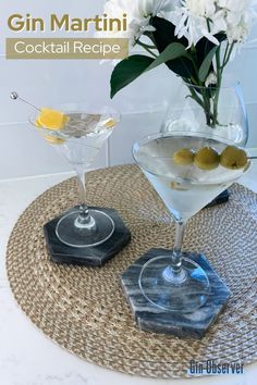 gin martini cocktail recipe with lemons and olives in coupe glasses on a tray