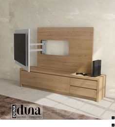 an entertainment center with a flat screen tv mounted to it's side