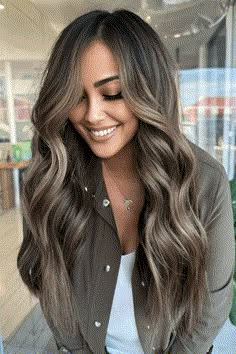 This gorgeous hairstyle for summer features dark brown hair that blends smoothly into highlights the color of caramel, giving it depth and warmth. The hair is worn in loose, flowing waves that make the transition between colors more natural and give it body, capturing the relaxed feeling of the season. With its easy mix of shades, - Click to see more of 38 Stunning Brunette Hair Colors to Elevate Your Summer Look and follow us for more hairstyle ideas. // Photo Credit: Instagram @hairbymkim Summer Hair 2024 Trend, Brown To Caramel Balayage, Summer 2024 Hair Color Trends, Long Prom Hair, Edgy Highlights, Hair Color Trends For Brunettes, Hairstyle For Summer, Brunette Hair Color Ideas, Balayage Techniques