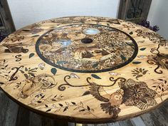 a wooden table with an artistic design on it