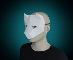 a man with a mask on his face is wearing a black t - shirt and has an origami cut out of it's head