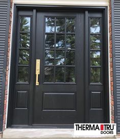 a black front door with two sidelights