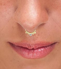 Diamond Solid 14k Gold Septum Ring Beautiful and delicate diamond septum ring that has exactly the right proportion, refinement, & glam to make your entire look shine through.  A must-have! Features: ❖ A single septum ring. ❖ Made from solid 14k gold and a 1.5mm genuine conflict-free diamond. ❖ Comes in a beautiful gift-ready package. Sample ring size:  ❖ Wire size: 18g ❖ 7mm (less than 5/16 inch) inner diameter  ❖ 3mm (3/32 inch) nose bottom to ring bottom  ❖ ❖ ❖  This is some of what customers Minimalist Yellow Gold Septum Ring For Wedding, Elegant Cubic Zirconia Nose Rings For Wedding, 14k Gold Round Septum Ring For Wedding, Elegant Wedding Septum Ring With Prong Setting, Diamond Septum Ring With Prong Setting For Wedding, Elegant 14k Gold Nose Ring As Gift, Elegant 14k Gold Septum Ring For Anniversary, Elegant 14k Gold Septum Ring As Gift, Elegant Wedding Septum Ring