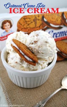 a bowl filled with ice cream next to crackers and a box of oatmeal creme