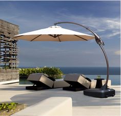 an outdoor lounge area overlooking the ocean