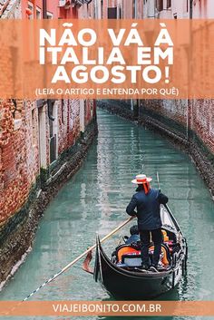 a man riding on the back of a boat down a canal