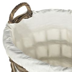 an empty wicker basket with white fabric