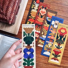 the bookmarks are decorated with flowers and leaves