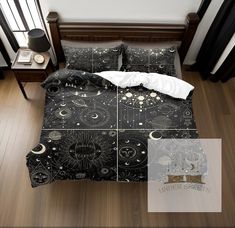 a bed with black and white comforter covers on top of wooden flooring next to a night sky scene