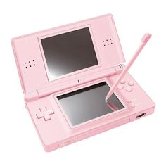 a pink nintendo wii game system with a pen sticking out of it's screen