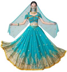 a woman dressed in a blue and gold belly dance costume with veil over her head