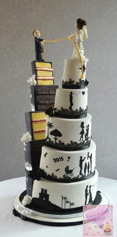 a wedding cake is decorated with black and white designs