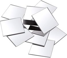 a pile of white square mirrors on top of each other