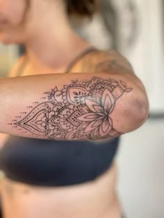 a woman with a tattoo on her arm