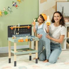 a woman and child are playing with toys