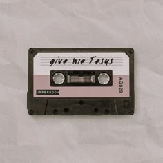 an old fashioned cassette tape with the words give me tens written in black on it