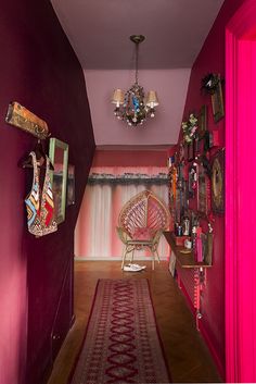 the hallway is decorated in pink and red