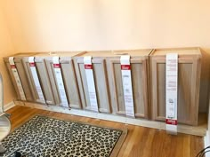 a bunch of cabinets sitting on top of a hard wood floor next to a heater