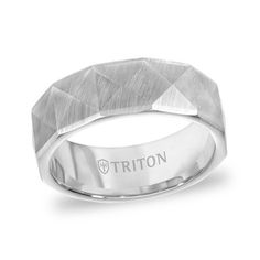 a men's wedding band in white gold with a diamond pattern on the side