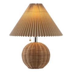 a wicker lamp with a beige shade on it