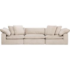 a large sectional couch with pillows on the top and bottom corner, in beige linen