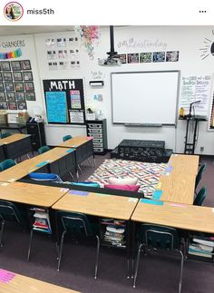 an empty classroom with desks and chairs