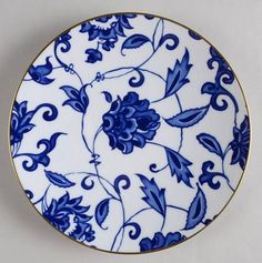 a blue and white plate sitting on top of a table