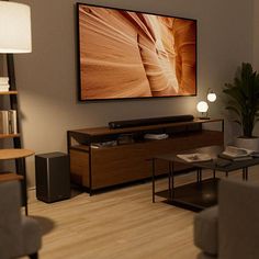 a living room filled with furniture and a flat screen tv mounted to the side of a wall