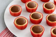 chocolates in red wrappers on a white plate