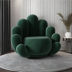 a green chair sitting on top of a rug