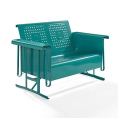 a green metal bench sitting on top of a white floor