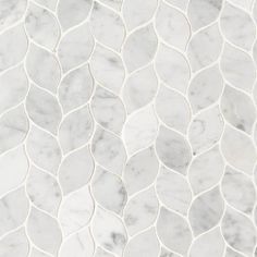 a white marble mosaic tile with wavy lines