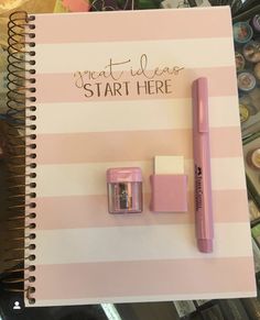 a notepad with a pen, eraser and lip balm on it next to a spiral notebook