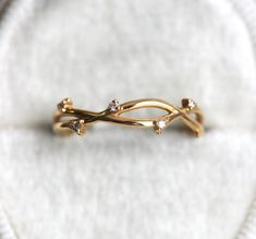 A simple twig band ring with diamonds made in 14k or 18k gold. Suitable for everyday wear. The design can be made with gemstones of your choosing. If you would prefer a custom ring, please contact us before purchase ★Details Gemstone: white diamonds Measurements: approx. 1.1 mm Quality: clarity grade VS, color grade G, conflict-free Material: 14k solid yellow gold, white gold, rose gold or 18k solid yellow gold, white gold, rose gold or platinum Sizes available: 2-8 (Larger and smaller sizes are Twig Wedding Band, Wedding Band Diamond, Twig Ring, Flawless Diamond, Ring Flower, Engagement Sets, Flower Bud, Favorite Rings, Diamond Wedding Bands