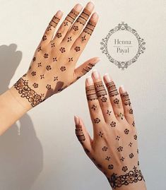 two hands with henna designs on them and a ring around the fingers that says henna payal