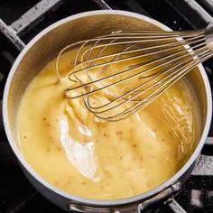 a pan filled with batter and whisk on top of an oven