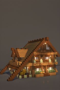 a large house made out of wood with lights on it's roof and windows