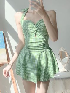 Elevate your poolside look with our this sweet swim dress. This sexy swimsuit dress, with its trendy plaid pattern, is a showstopper. The backless design and frill detailing make a flirty statement, while the ruffle hem adds a feminine touch. The spaghetti strap neckline and lace-up tie back give this high waist piece a contemporary edge. Sleeveless and short in length, it's perfect for soaking up the sun. The flounce hem completes this gorgeous dress, ensuring you'll be the hottest babe at any summer gathering. You definitely need this knockout number in your swimwear collection. Style: SexyPattern Type: PlaidDetails: Backless, Frill, Ruffle Hem, lace up, Tie BackNeckline: Spaghetti StrapType: CamiSleeve Length: SleevelessWaist Line: High WaistHem Shaped: FlounceLength: Short Korean One Piece, Soft Girl Aesthetic, Women Skirt, Green Swimsuit, Swimsuit Women, Hot Spring, Beach Swimwear, Swimsuit Dress, Swimsuits Halter