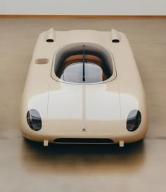 an old fashioned car is parked in a garage