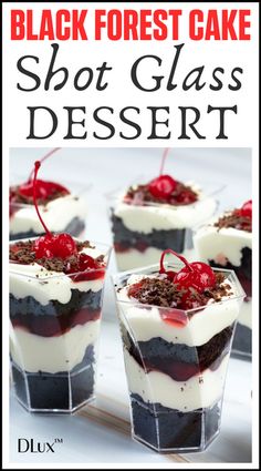 black forest cake with white frosting and red cherries on top, served in small dessert cups