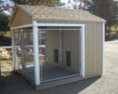 a small dog house with a fence around it