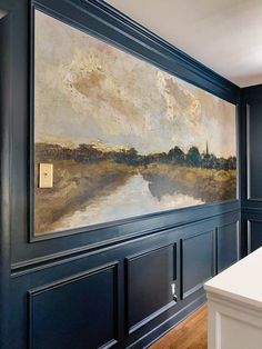 a painting on the wall above a kitchen counter