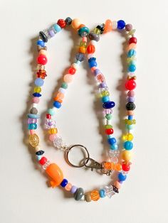 Multicolor JOY! - One of a kind extra long lanyard chain AND/OR necklace - Mix of acrylic, glass, vintage beads on nylon cord with silver clasp and key chain - Reds, oranges, greens, peaches, lavender, blues - Please note that I try to use all beads so some may be imperfect but it's part of the beauty Wall Weave, Rainbow Keychain, Lanyard Necklace, Beaded Lanyard, Beaded Lanyards, Vintage Beads, Eyeglass Chain, Beaded Keychains, Jewelry Business