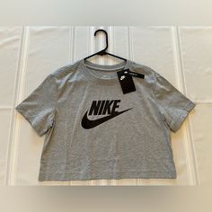 Nike Tshirt Xs Brand New With Tags Crop Style Smoke / Pet Free Home Nike Athleisure Tops With Letter Print, Nike Gray Tops With Letter Print, Nike Athleisure T-shirt For Spring, Nike Summer Gray Tops, Nike Basic Tops For Spring, Nike Trendy Top For Spring, Trendy Nike Short Sleeve Tops, Gray Logo Print T-shirt For Spring, Nike Basic Tops With Letter Print