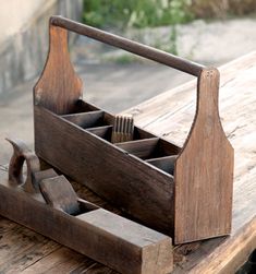 an old wooden tool box with tools in it