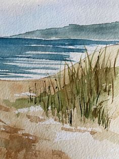 watercolor painting of grass on the beach